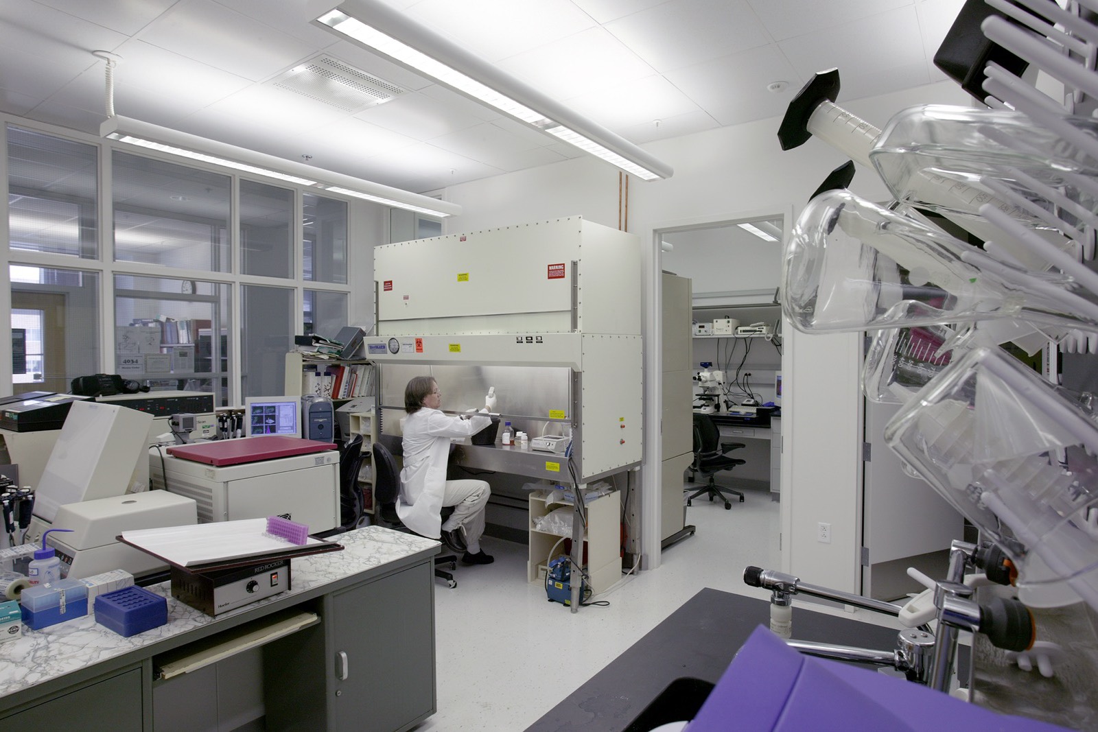 A scientist working at a cabinet in an FDA laboratory