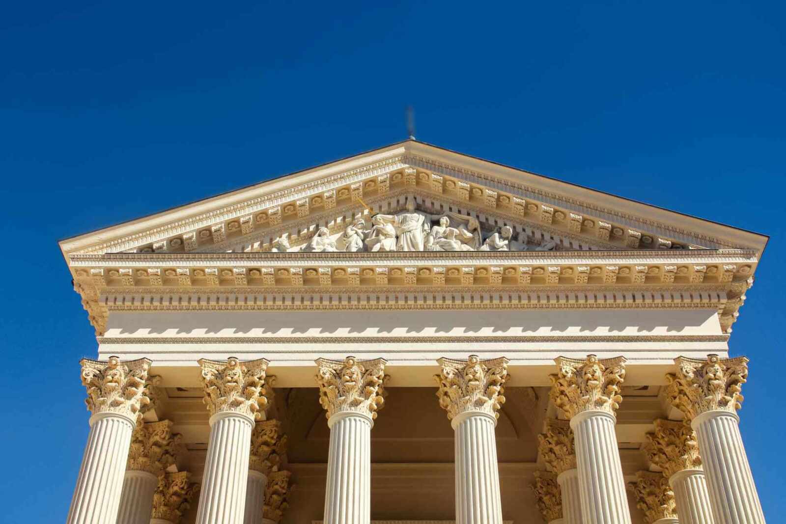 A classical government building's pediment and columns against a clear blue sky, a generic stand-in for FDA's regulatory authority