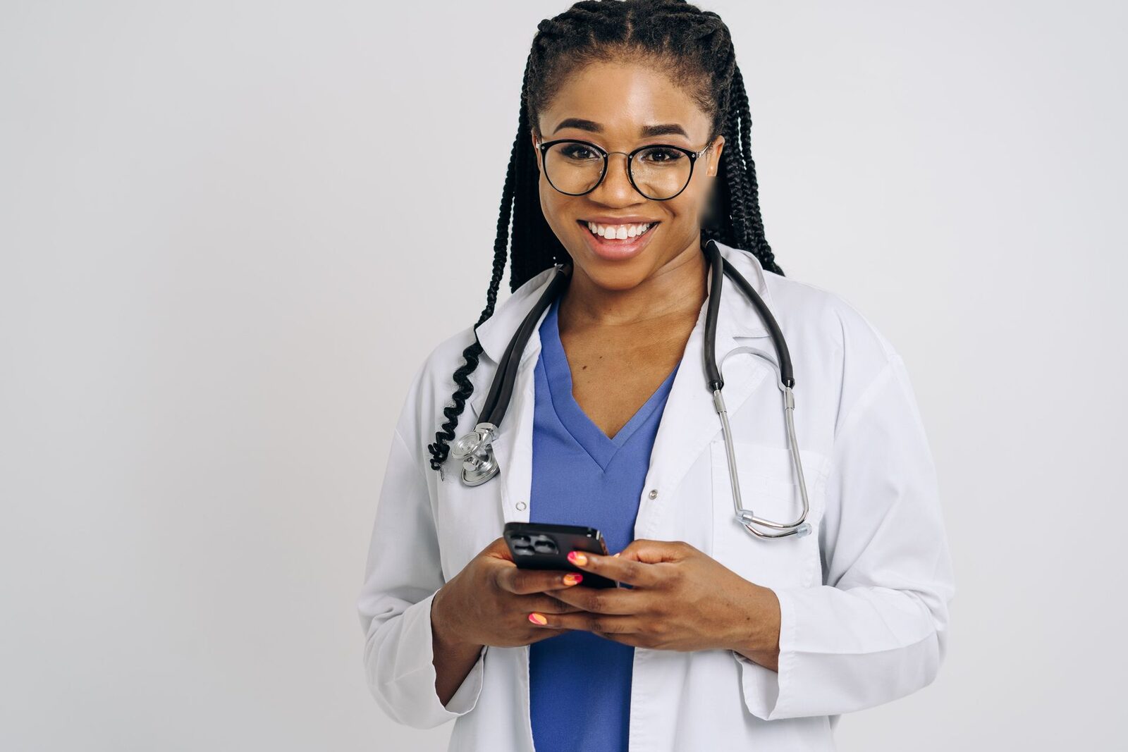 A physician in a white coat with a stethoscope, a generic stand-in for a vascular surgeon or interventional radiologist