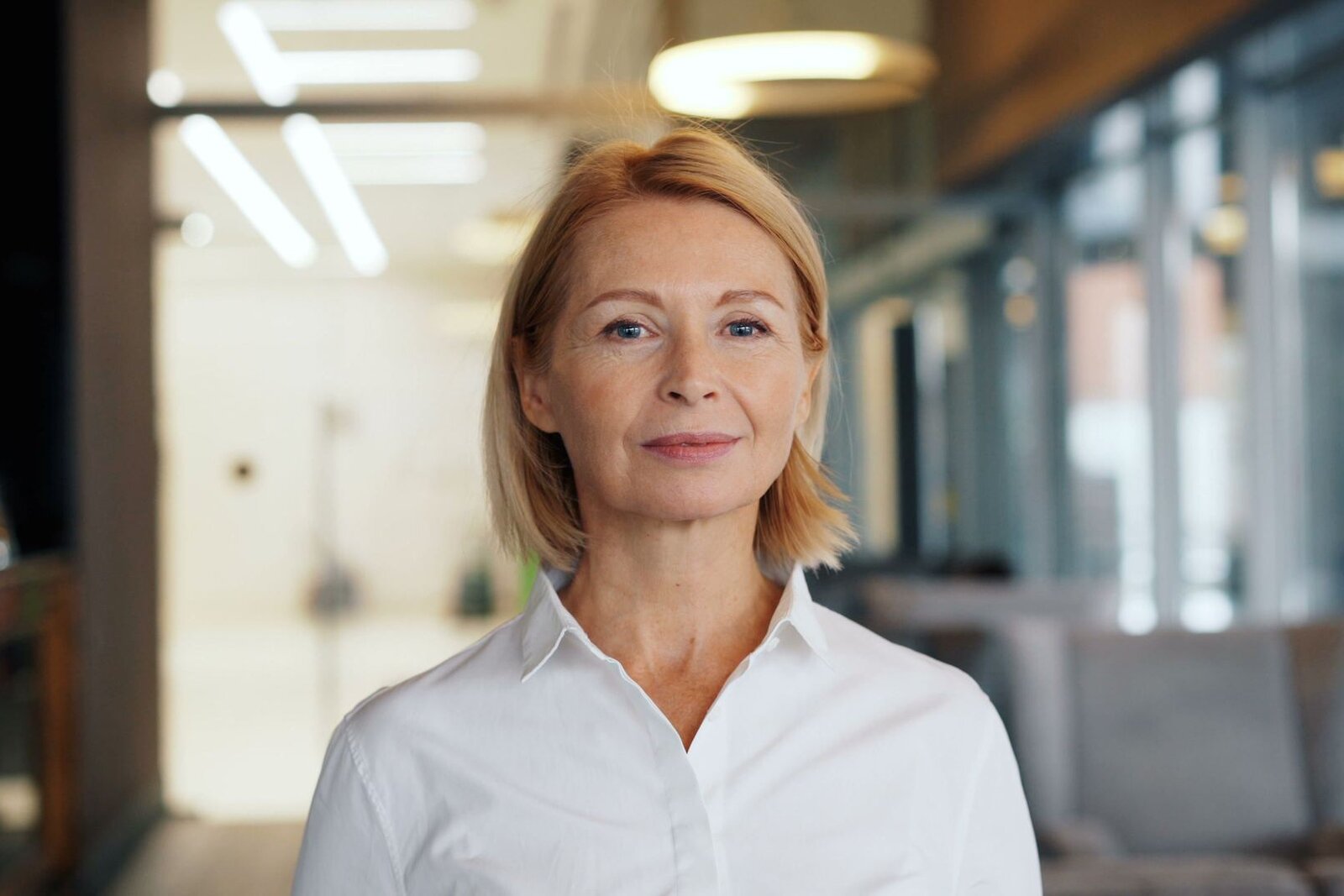 A senior medtech executive in a bright office, standing in for Haemonetics' FDA approval announcement
