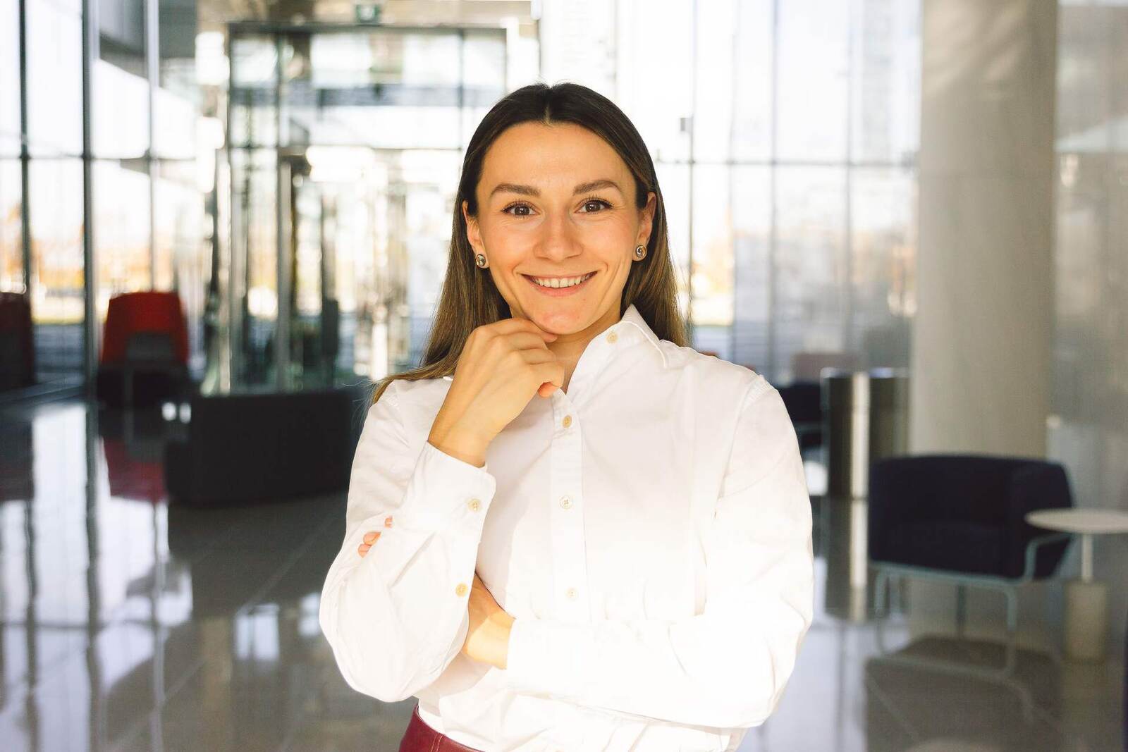 A smiling executive in a bright office lobby, a generic stand-in for AbbVie leadership announcing the approval