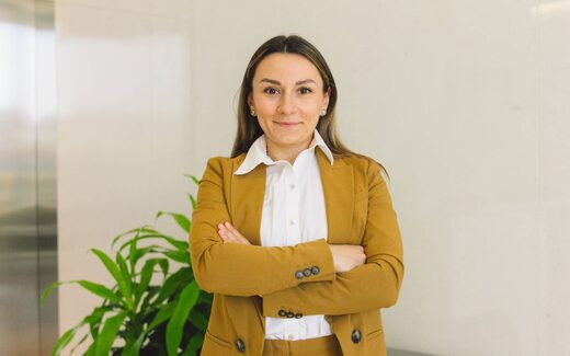 A healthcare professional in business attire, standing in for the regulatory and clinical affairs response to an FDA device alert