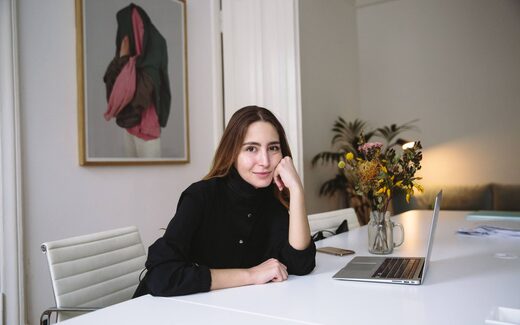 A company executive working at a laptop