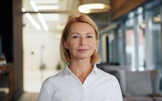 A senior medtech executive in a bright office, standing in for Haemonetics FDA approval announcement
