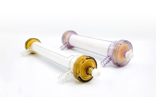 Two SeaStar Medical Selective Cytopheretic Device cartridges, the pediatric and adult versions, lying side by side on a white surface