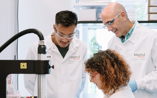 A professional smiles in a research-office portrait, standing in for the Soufflé Therapeutics team marking its Series B close