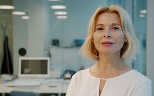 A medtech executive in a bright open office, standing in for Sequel Med Tech's FDA clearance announcement